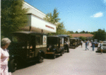 7 Model A/AA Mail Trucks gathered in front of the Hawthorn County Hall