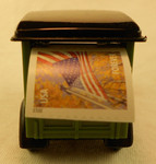 Dispenser showing stamp exiting rear of Mail Truck